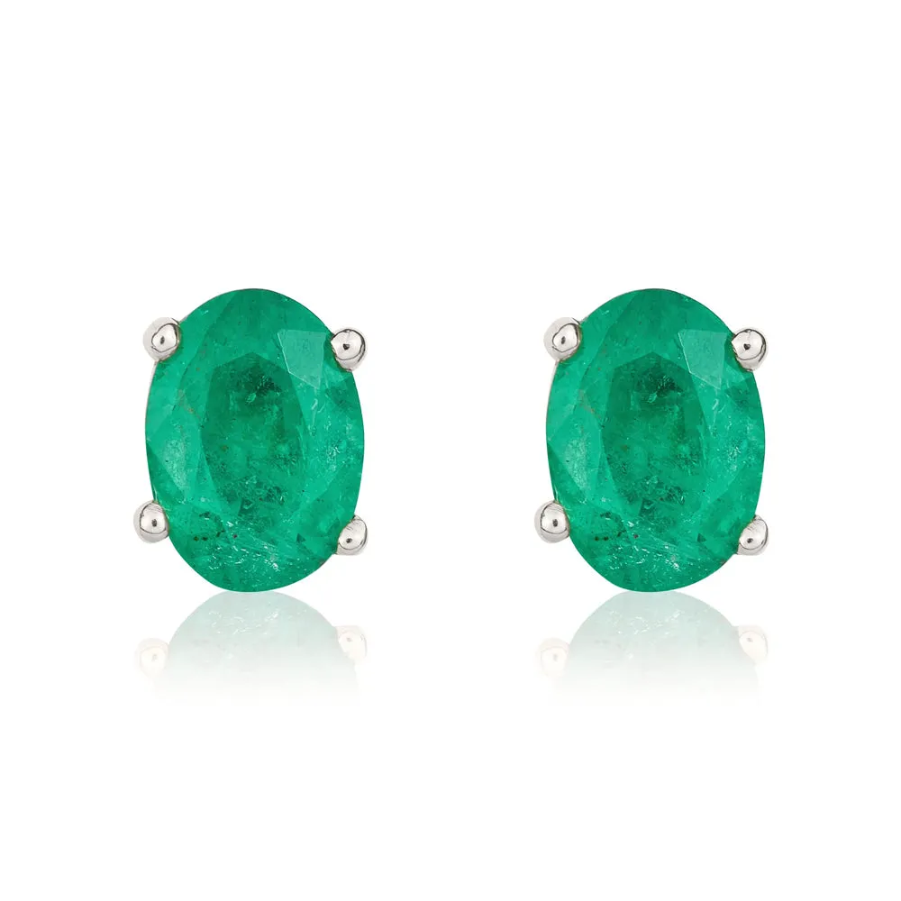 9ct White Gold Emerald 7x5mm Oval Claw Set Stud Earrings